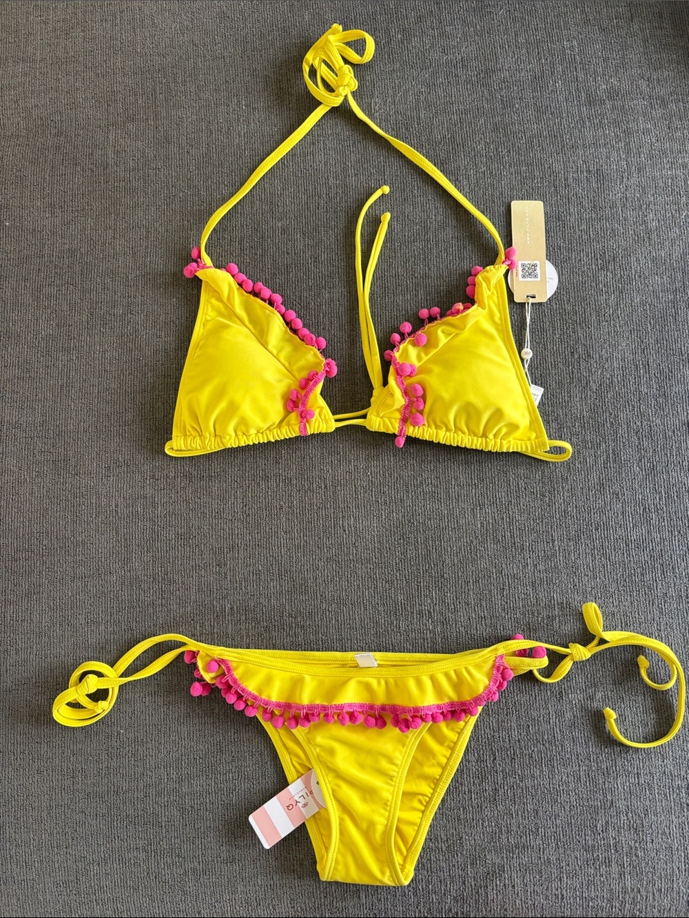 NWT PQ yellow tie side set, with pink ruffle pompoms. Size small.